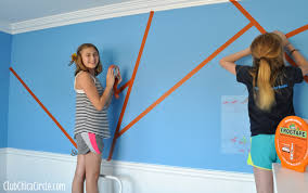Use painter's tape to create the trellis pattern and then paint over it. Modern Art Wall Design Diy For The Coolest Wall Ever