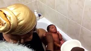 Keep one hand supporting the baby's back, neck and head as you carefully lower him or her into the tub. Neriahs First Bath Traditional Nigerian Newborn Bath With Palm Oil Video Dailymotion