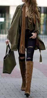 Black Boots With Jeans Women Woman Wearing Ripped Black Jeans Olive Green Top Olive Green Jacket Brown Scarf Olive Green Handbag And Brown Boots Brown Outfit Fashion Brown Boots Outfit