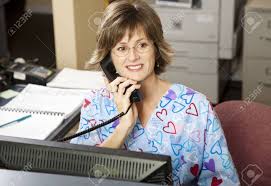 Busy Medical Receptionist Working The Front Desk At A Doctor S Stock Photo Picture And Royalty Free Image Image 6453363