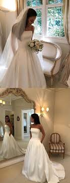 We make high quality dresses in accordance with the pictures. Simple Ivory Satin Strapless With Pockets Ball Gown Wedding Dresses Db Daintybridal