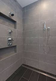 A large format 'rectified tile 600x300mm or larger. Tile And Bathroom Remodels Issaquah Sammamish Bellevue Bathroom Shower Tile Large Shower Tile Shower Tile