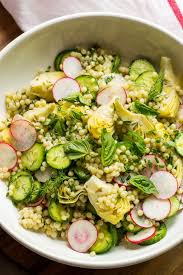 Incredibly Fresh And Full Of Spring Vegetables This Israeli Couscous Salad Is The Best Salad Springs Couscous Recipes Couscous Salad Israeli Couscous Salad