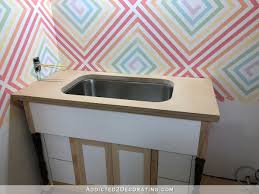The countertops have to be pulled away from the wall when you place the laminate on, so just keep that in mind. Diy Mdf Bathroom Countertop For An Undermount Sink Addicted 2 Decorating