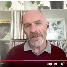 What does Simon say to make Angela fall of her chair?