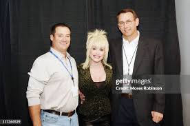 Chris Hendley, marketing manager, Dolly Parton and Joey Dennis,... News  Photo