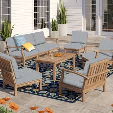 Teak outdoor chairs paired with an outdoor coffee table can instantly add an element of sophistication to your patio. Teak Outdoor Furniture Joss Main