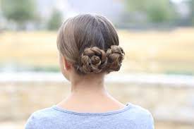 Prim S Braided Bun Updo Mockingjay Hairstyles Hair Styles Medieval Hairstyles Competition Hair