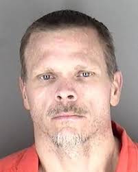 Armed Kansas burglar found hiding in McDonald's bathroom, police say