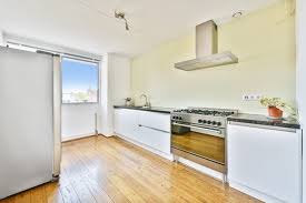 Galley kitchen with island is definitely guaranteed wonderful in creating more functional kitchen while also more enhanced significantly in beauty and value. Premium Photo Design Of Open Plan Kitchen With Stone Counters And Island In Middle Under Ceiling With Wooden Beams
