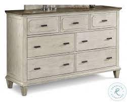 The pristine white tub, sink, and medicine cabinet really pop against the ridged ceiling, stone walls, and wood floors. Newport Off White And Rustic Brown Dresser From Flexsteel Coleman Furniture