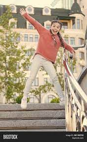 Standing at the top of a long flight of stairs can be frightening for a child. Running Down Stairs Image Photo Free Trial Bigstock
