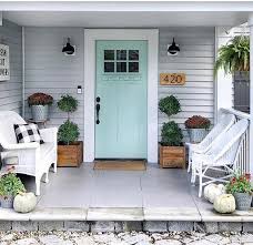 Hang a wreath with touches of blue for a pulled together look. 32 Best Front Door Paint Color Ideas