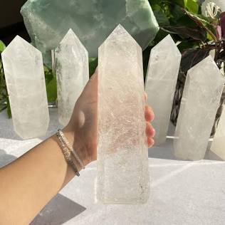 A Clear Quartz tower is the premier Master Crystal due to its ability to amplify any intention., AI generated