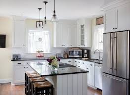 It makes the room looks bigger. Environmentally Friendly Design Brings New Life To Old Homes Textures Flooring Nashvill Kitchen Designs Layout Modern White Kitchen Cabinets Kitchen Design