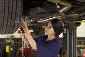 Female Auto Mechanic Working Underneath Car In Garage Woman Mechanic Car Mechanic Girl Mechanics
