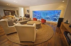 This room divider aquarium also acts as a bar top on the kitchen. Man Makes A Massive 30 000 Liter Aquarium In His Living Room Luxurylaunches