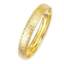 Intricate botanical designs are engraved in warm yellow gold, covering the entire bracelet. 10mm Floral Pattern Engraved 14k Yellow Gold Bangle Bracelet
