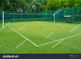 The Sports Playground In The Park With Artificial Grass And A Stretched Net On A Background Of Green Trees Ad Affiliate Artificial Grass Grass Playground