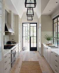 Galley kitchen layouts have some trademarks, and first among them is a design that features two parallel walls with a narrow passage between them. Pin By Solange Tiburi On Kitchens Interior Design Kitchen Home Kitchens Kitchen Design