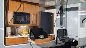 Toy hauler with outdoor kitchen. 10 Amazing Rvs Outdoor Entertaining Kitchens
