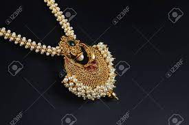 This gold pearl necklace is the favourite of most indian traditional festivals/functions. Indian Traditional Gold Necklace With Pearl Stock Photo Picture And Royalty Free Image Image 58815704