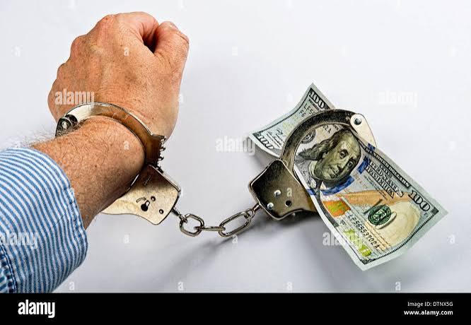 Man made prisoner to cold hard cash Stock Photo - Alamy