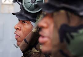 Aviation Ordnancemen Airman Kevin N. Pitchford, left, and Byron A. Jordan  stand watch during a general quarters drill aboard the aircraft carrier USS  George H.W. Bush (CVN 77).