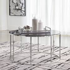 Try a wider, oval shape for sectionals, or keep things cozy by pairing a loveseat with a round coffee table. Ashley Furniture Homestore Belize Just In Reflect Your Love Of Ultra Modern Style With The Clenco Round Coffee Table View It In Our Showroom Today On The 3rd Floor At Mirab We