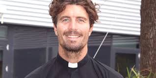 Fr Liam receives bravery medal after shark attack rescue