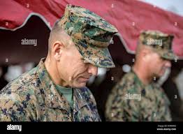 U.S. Marine Corps Col. Fridrik Fridriksson, commanding officer of the 15th  Marine Expeditionary Unit, receives the non-commissioned officer sword from  Sgt. Maj. Daniel Mangrum, outgoing sergeant major of the 15th MEU, during