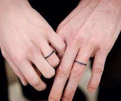 20 Minimalist Tattoos For The Design Lover Wedding Band Tattoo Tattoo Wedding Rings Ring Finger Tattoos