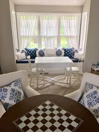 Built In Window Seat With Puzzle Table And Armchair Seating Area With Game Table Livingroom Layout Room Layout Room