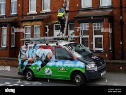 A Sky Engineer Installs A Satellite Dish On A House In Garforth, Britain  March 17, 2016. Reuters/Darren Staples Stock Photo - Alamy