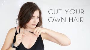 Once your ponytail is neat and there are no bumps, loosen and pull the hair elastic down in front of your face so there are only a couple inches left in the ponytail. 10 Ways To Cut Your Own Hair How To Give Yourself A Haircut