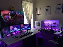 You don't want a desk that's laden with greasy pizza boxes, and a floor the dim shades of violet are easy on the eye, and contrast perfectly with the white and black of the desk. Black Gaming Room Novocom Top