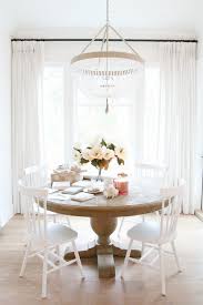 Contemporary dining room features a dark gray velvet tufted dining settee with restoration hardware aero white marble and brass oval dining table, dark surrounded by restoration hardware bondi teak lounge chairs, a black aluminum dining table is positioned on gray pavers under skylights lit by. Restoration Hardware French Urn Pedestal Round Dining Table Copycatchic