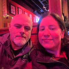 Man helps woman after fall at Hannaford