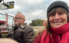 A friend of mine took this shot of me leaving a pub car park when there  were cars parked opposite the entrance. My expression is no doubt well  known to other Triumph