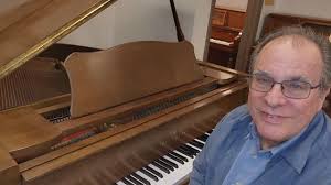 Here is a Glossy Black Baby Grand for under $5K from The Piano Guys. It's a  Bergmann made by Young Chang less than 20 years ago, in like-new condition.  Just 5' long,