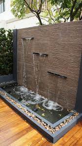 A water feature may be indoor or outdoor and can range in size from a desk top water fountain to a large indoor waterfall that covers an entire wall in a large building, and can be made from any number of materials, including stone, stainless steel, resin, iron and glass. Outdoor Fountains And Water Features Outdoor Wall Fountains Garden Wall Decor Outdoor Water Features
