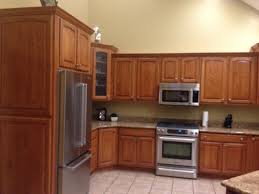 Consider staining kitchen cabinets instead as an affordable way of updating kitchen cabinets. Oak Kitchen Cabinets Help What To Do Stain Or Paint
