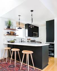 Like in general for small kitchens light colors such as white or cream cupboards and countertops open the space up, giving it larger look while dark colors like black and white are two such colors that make a bold visual statement and suits lot of styles. Minimalist Small Black And White Kitchen Novocom Top