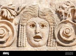 Stone faces bas relief at Myra ancient city. Demre, Turkey Stock Photo