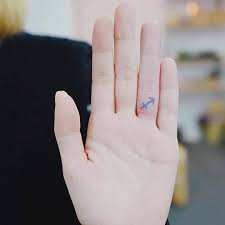 Tiny Colorful Anchor Tattoo On The Right Hand S Ring Finger Tattoos Tattoos For Guys Mini Tattoos