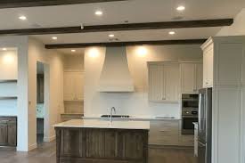 Traditional styled kitchen with gray cabinets painted in benjamin moore gray owl with white marble countertops and nickel hardware. 8 Best Kitchen Paint Colors