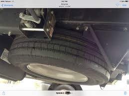 Can see the tire mounted underneath in the back of the frame, but unable to find anything in the owners manual on lowering it from the mount. Adding Spare Tire Carrier Winnebago Owners Online Community