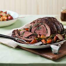 Arugula Stuffed Leg Of Lamb With Roasted Spring Vegetables Lamb Recipes Spring Vegetables Lamb Leg