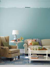 Upholstered accent chairs and matching ottomans repeat the hue throughout the space for a cohesive look. 30 Best Living Room Paint Color Ideas Top Paint Colors For Living Rooms