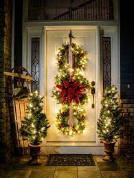 Our Front Door Is Having An Identity Crisis There Are Pumpkins On The Steps And This Darlin Christmas Porch Decor Christmas Door Decorations Indoor Christmas